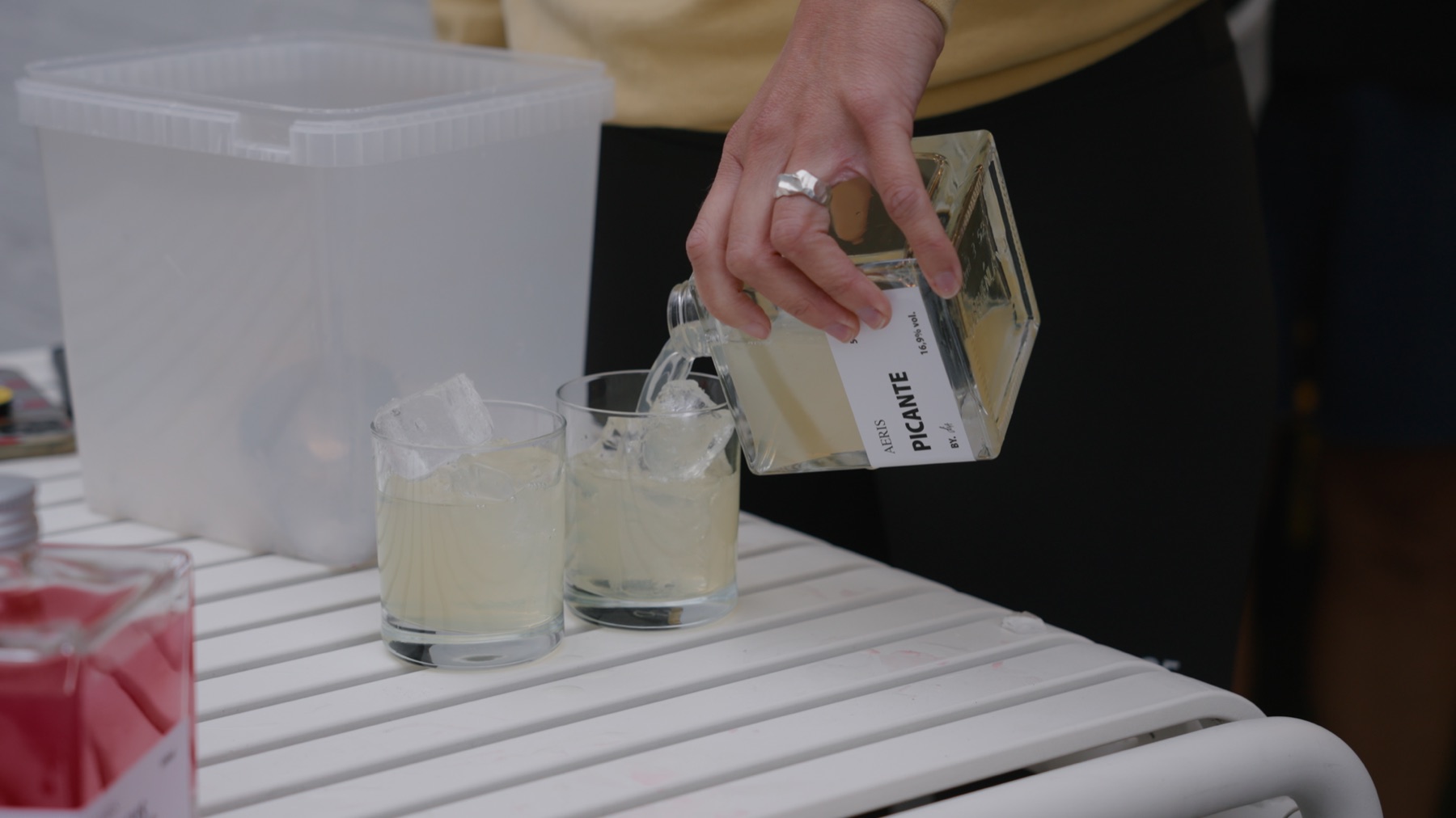 Aeris cocktail being poured over ice