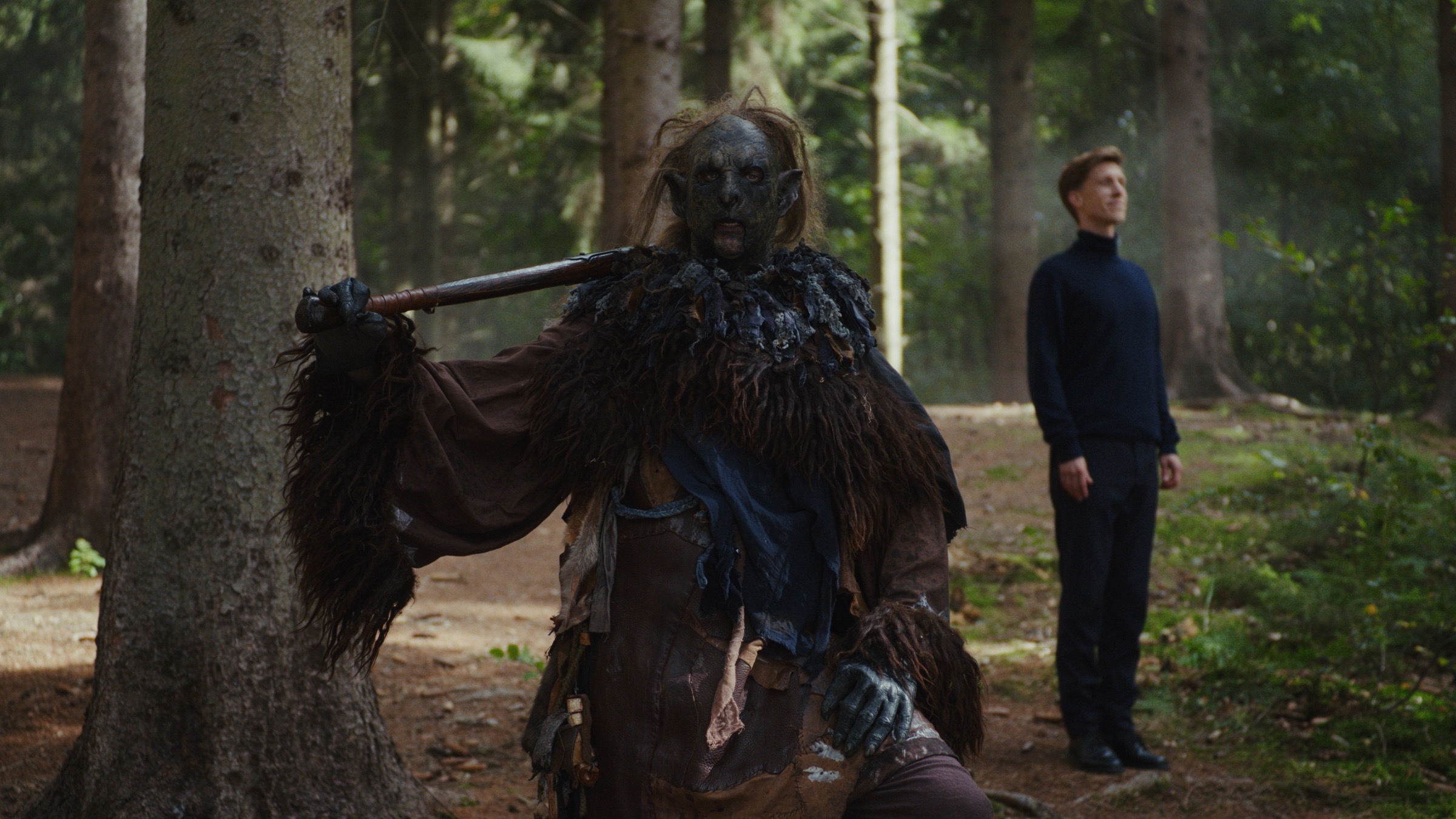 Fantasy creature and Dinero Pro assistant in a forest