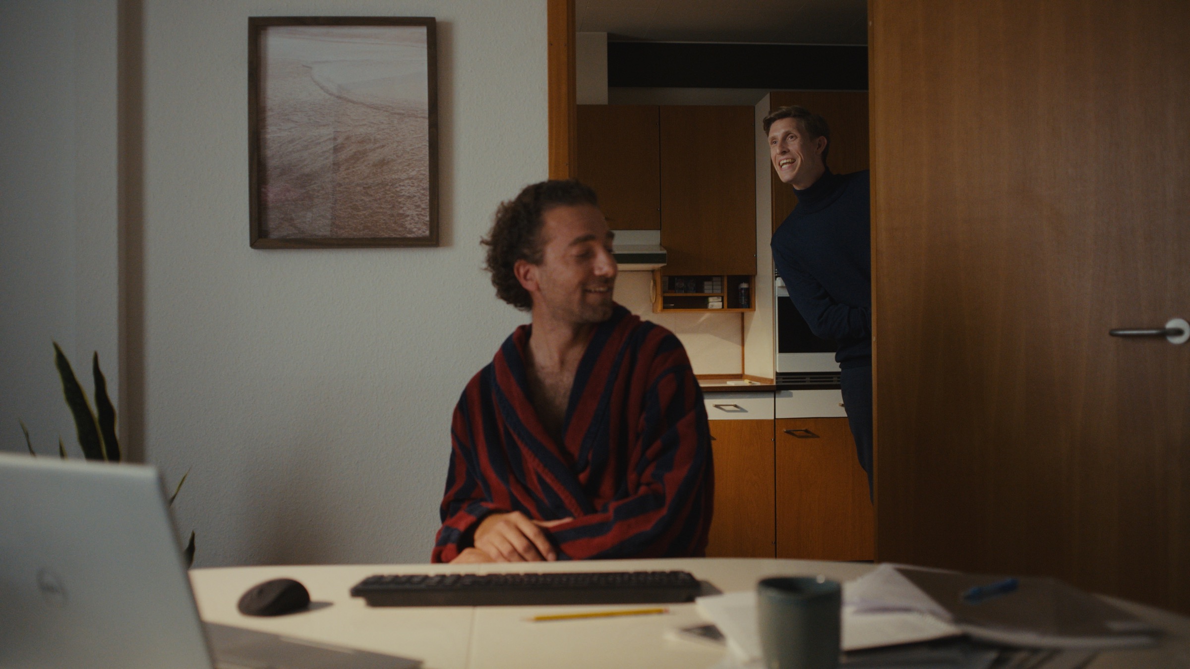 Dinero Pro assistant appearing in the doorway of a home office