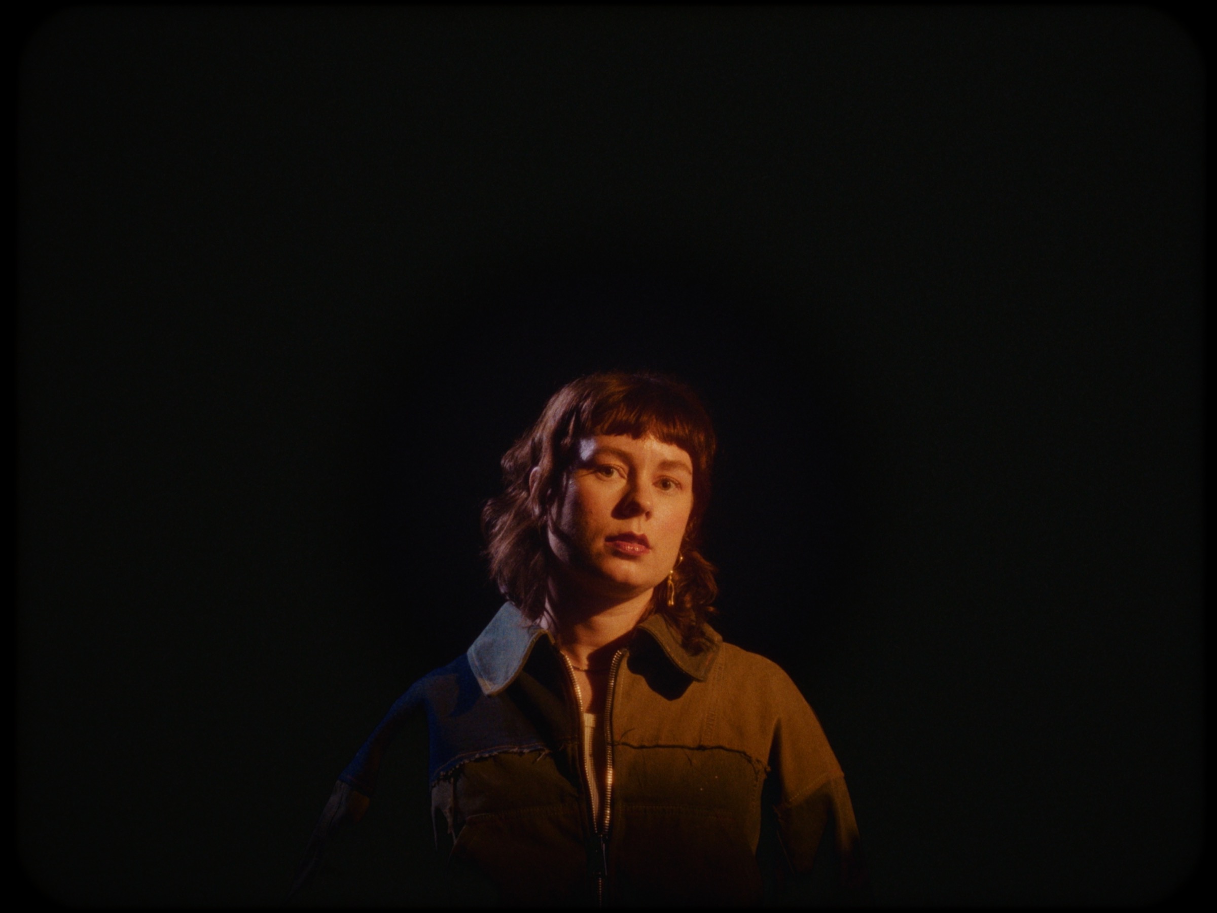 Portrait of Julie Ellinor in warm stage light
